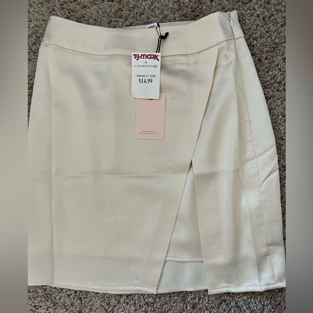 Cream skirt.